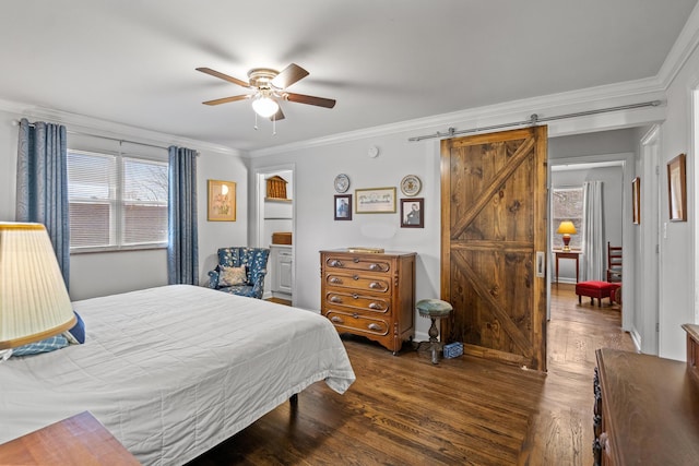 bedroom featuring crown molding, ceiling fan, a barn door, and dark hardwood / wood-style flooring