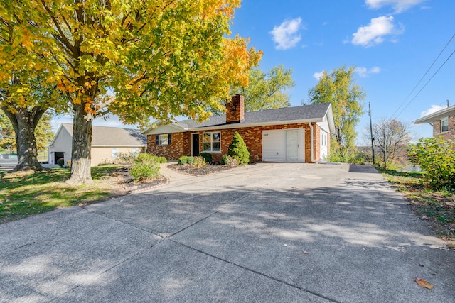 ranch-style house featuring a garage