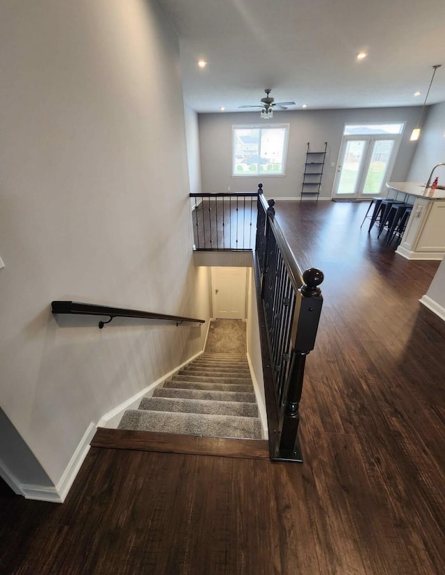 stairs featuring recessed lighting, baseboards, and wood finished floors