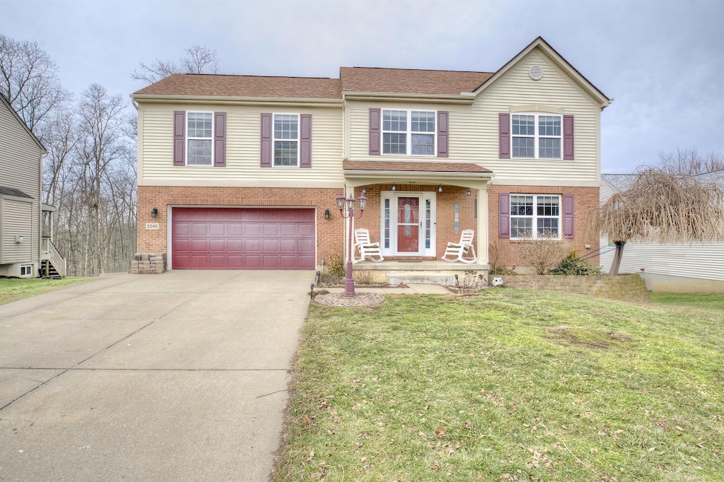 view of front of home with a garage and a front yard