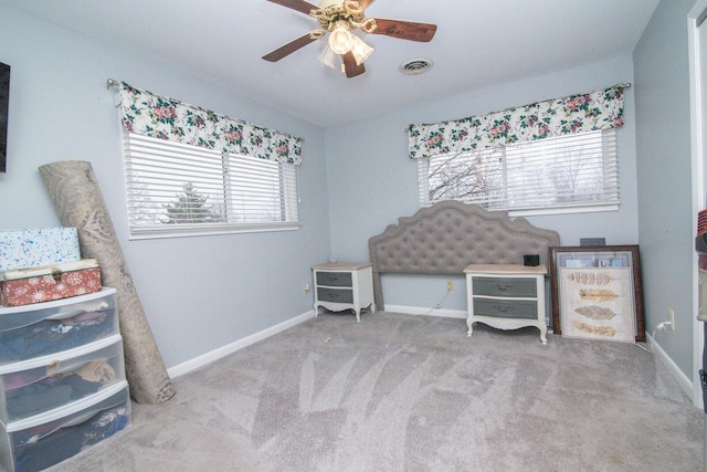 miscellaneous room with ceiling fan and light colored carpet