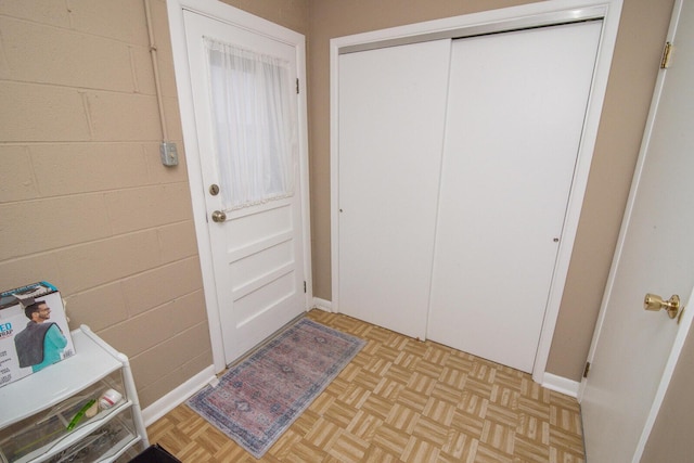 doorway with light parquet flooring