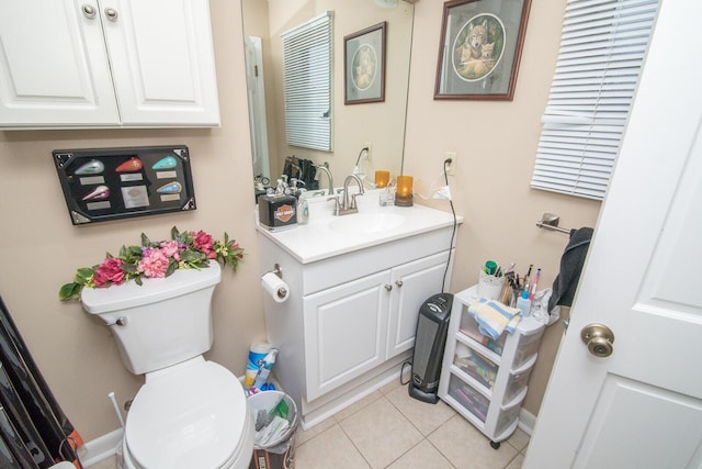 bathroom with vanity, tile patterned floors, and toilet