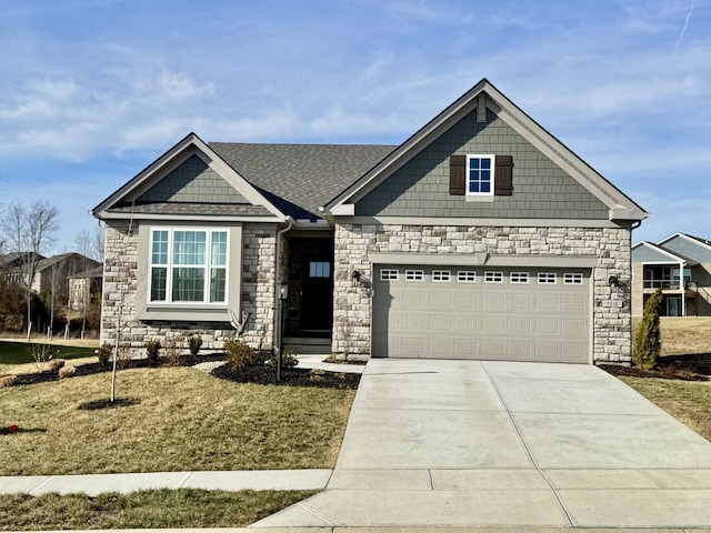 craftsman-style house featuring a garage and a front lawn