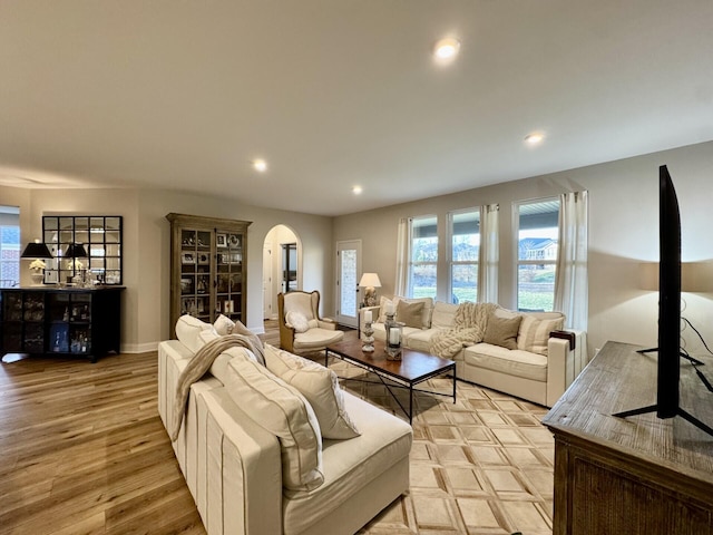 1516 Brumfield Ct, Union, KY 41091 - living room featuring arched walkways, plenty of natural light, recessed lighting, and light wood finished floors