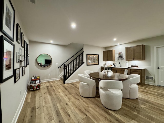 1516 Brumfield Ct, Union, KY 41091 - dining space featuring stairs, recessed lighting, light wood-type flooring, and baseboards