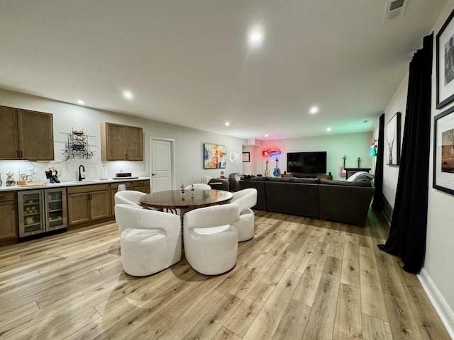 1516 Brumfield Ct, Union, KY 41091 - dining area with wine cooler, light wood finished floors, and recessed lighting