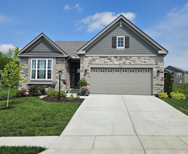 1516 Brumfield Ct, Union, KY 41091 - craftsman house featuring stone siding, driveway, a front yard, and an attached garage