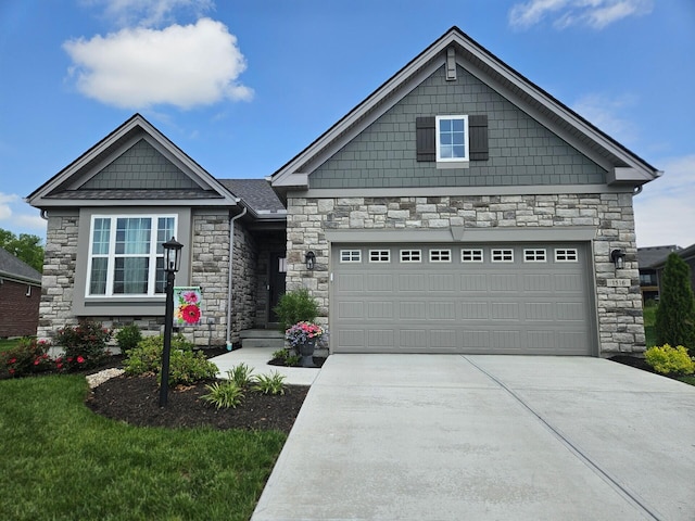 1516 Brumfield Ct, Union, KY 41091 - craftsman house featuring stone siding, concrete driveway, and an attached garage