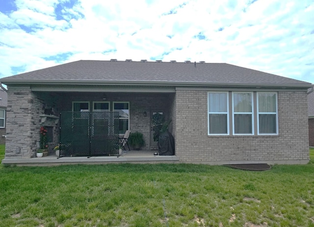 1516 Brumfield Ct, Union, KY 41091 - back of house with brick siding, a yard, a patio, and a shingled roof