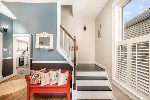 stairway with hardwood / wood-style floors