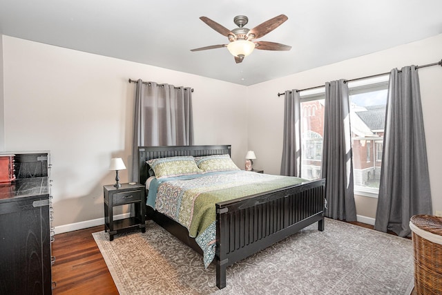 bedroom featuring dark hardwood / wood-style flooring and ceiling fan