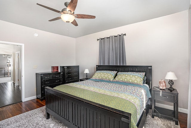 bedroom featuring dark wood-type flooring and ceiling fan