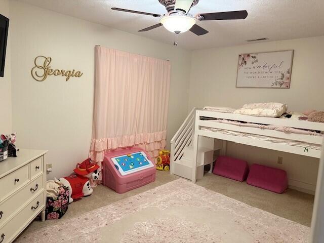 bedroom featuring carpet flooring and ceiling fan