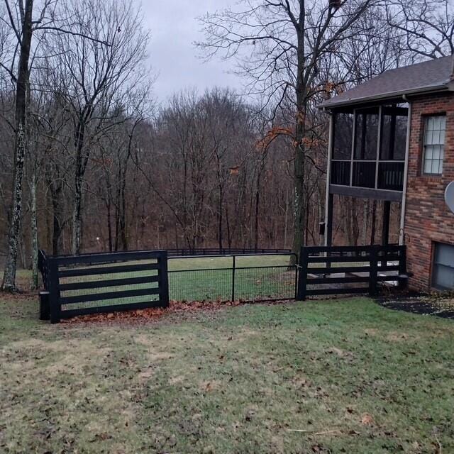 view of yard featuring a sunroom