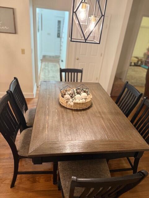 dining space featuring wood-type flooring