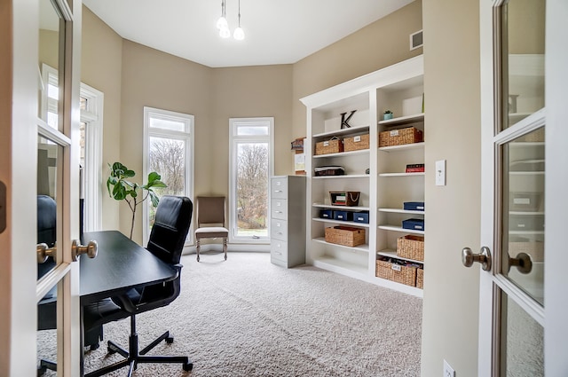 office featuring built in shelves and carpet flooring