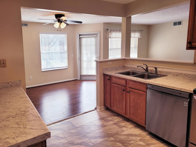 kitchen with dishwasher, sink, ceiling fan, and kitchen peninsula