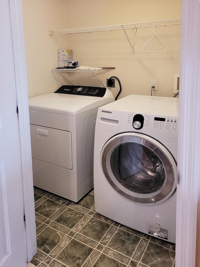 laundry room with washing machine and dryer