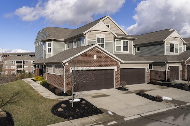 view of front of property featuring a garage and a front yard