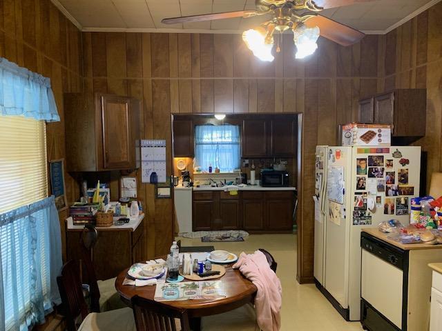 336 Roland Ave, Owenton, KY 40359 - kitchen with light countertops, white appliances, a ceiling fan, and dark brown cabinets