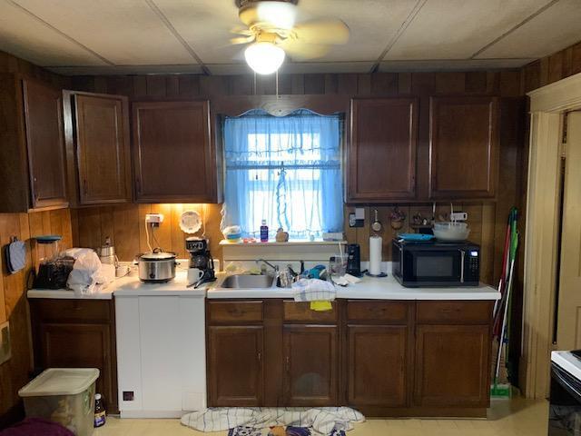 336 Roland Ave, Owenton, KY 40359 - kitchen featuring black microwave, light countertops, a sink, and ceiling fan