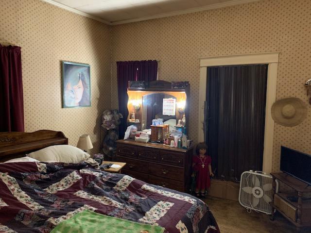 336 Roland Ave, Owenton, KY 40359 - carpeted bedroom with crown molding and wallpapered walls