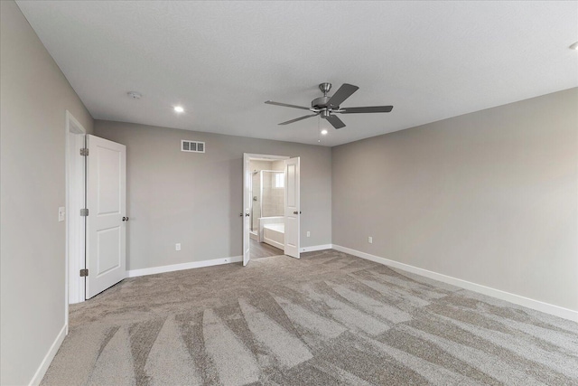 unfurnished bedroom with carpet floors, recessed lighting, visible vents, and baseboards