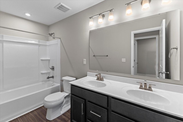 full bathroom featuring shower / bathtub combination, wood finished floors, a sink, and visible vents