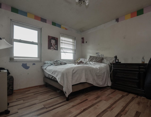 bedroom featuring wood-type flooring