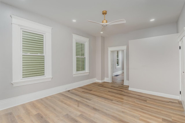 unfurnished room with ceiling fan and light hardwood / wood-style floors