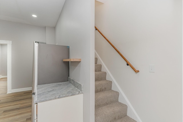 stairway with wood-type flooring