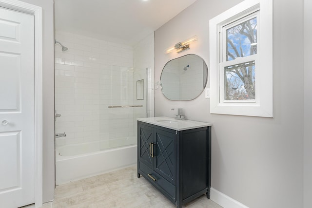 bathroom with vanity and tiled shower / bath