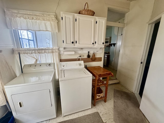 washroom featuring washing machine and dryer