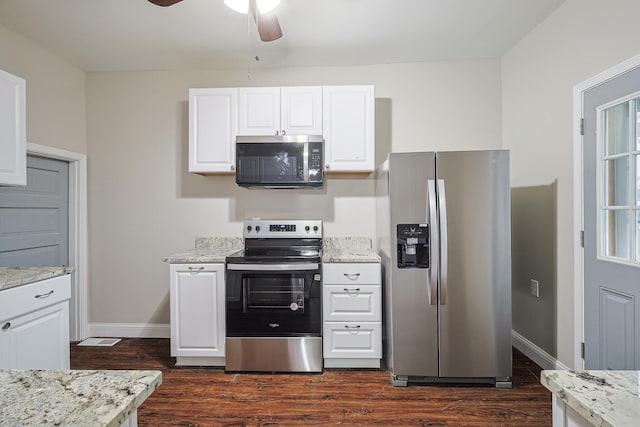 kitchen with ceiling fan, stainless steel appliances, light stone countertops, white cabinets, and dark hardwood / wood-style flooring