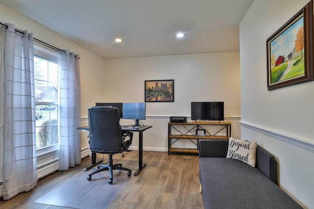 office featuring wood-type flooring and a baseboard radiator