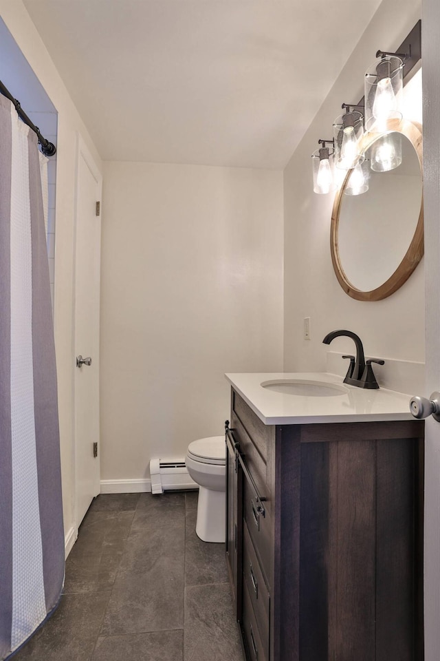 bathroom with a baseboard radiator, vanity, and toilet