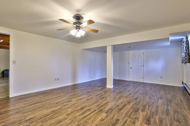 basement featuring ceiling fan and dark hardwood / wood-style flooring