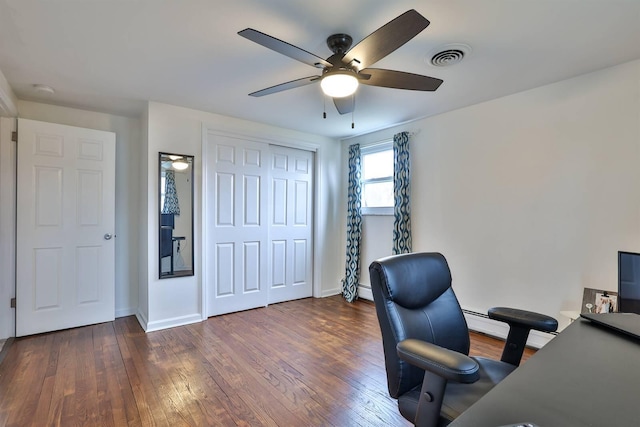 office with dark wood-type flooring, ceiling fan, and baseboard heating