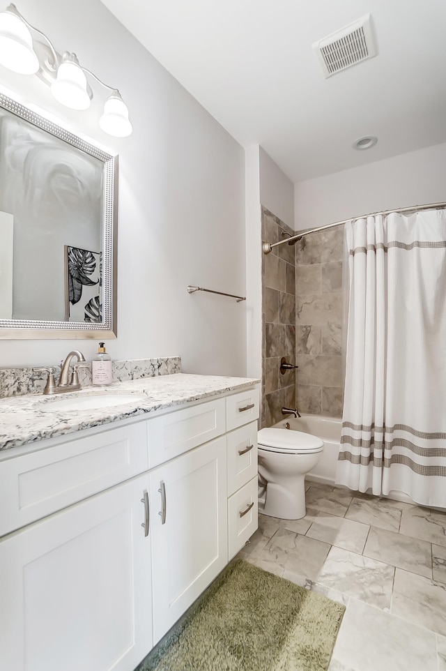 full bathroom with vanity, toilet, and shower / bath combo with shower curtain