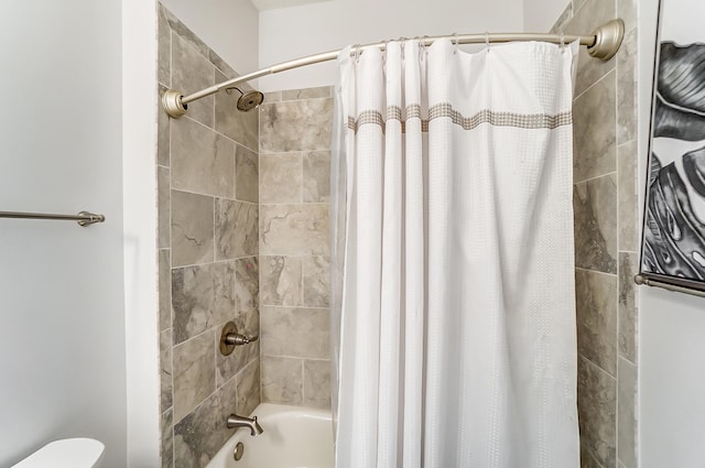 bathroom with shower / bathtub combination with curtain