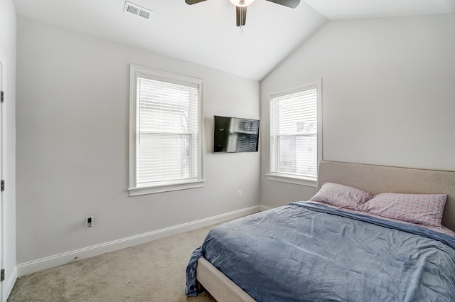 bedroom featuring lofted ceiling, ceiling fan, and carpet flooring