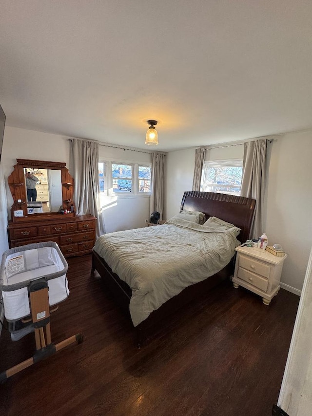 bedroom featuring dark wood-type flooring