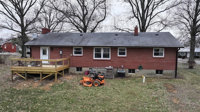 back of property featuring cooling unit, a yard, and a deck