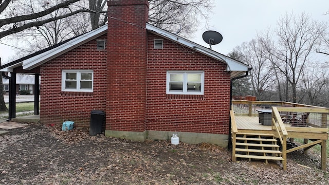 view of home's exterior with a deck