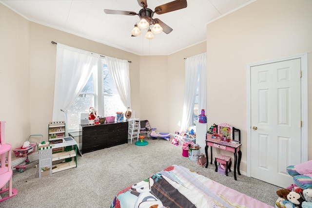 game room featuring crown molding, ceiling fan, and carpet floors