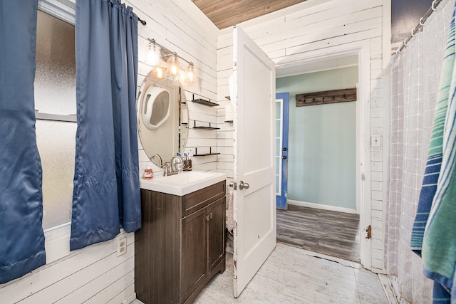 bathroom with wood ceiling, vanity, and wood-type flooring