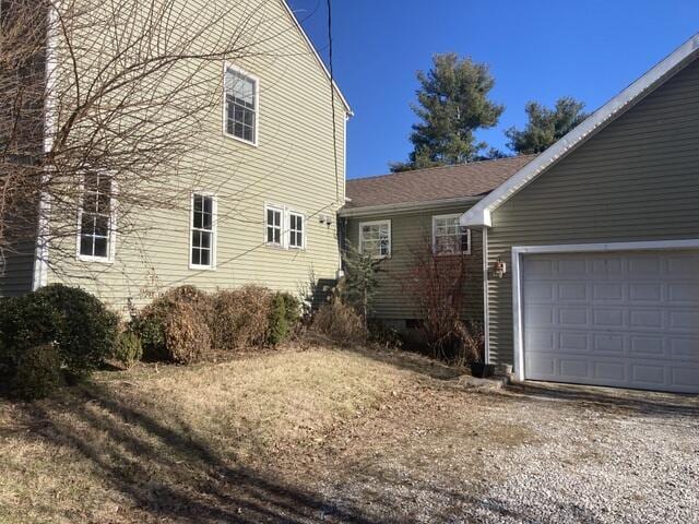 view of side of home with a garage