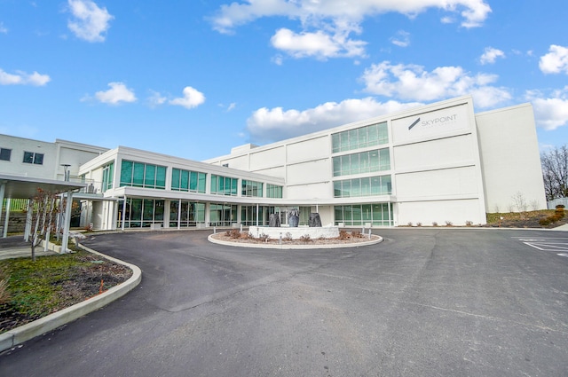 view of building exterior featuring aphalt driveway