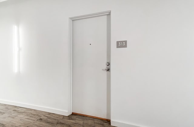 spare room featuring dark wood-style flooring